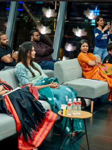 Priyanka Edupuganti seated among guests