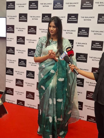 Priyanka Edupuganti being interviewed by a local news channel during her novel launch event.
