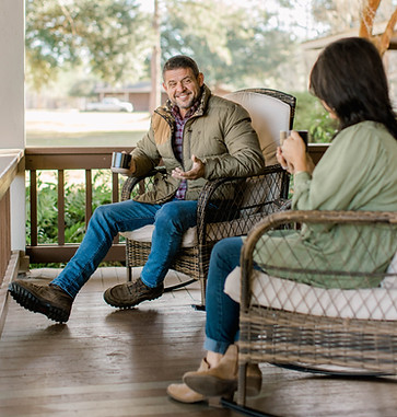 Man and woman on porch at Live Oak Plantation