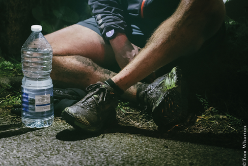 Ultra-runner Mike Samuels competing in the Arc of Attrition 100 in Cornwall, tackling the rugged South West Coast Path between Coverack and Portreath. Set against the dramatic Cornish coastline, the images show steep cliff paths, rocky coves and wild Atlantic seascapes in challenging winter conditions. Battling mud, darkness and coastal weather, he runs across remote headlands and technical terrain during one of the toughest ultra marathons in the UK. Photographed by Tom Wharton, the series captures endurance running in Cornwall, from pre-dawn race starts and windswept coastal trails to moments of exhaustion, resilience and determination during his 100-mile effort and historic out-and-back challenge along the Cornish coast.