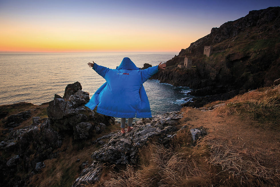 Cal Major showcasing a dryrobe in cornwall image by James Appleton