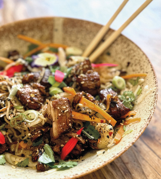 Hippo Naturopathic Bistro in Moretonhampstead on the edge of Dartmoor, Devon, showcasing a nutrient-dense whole food menu rooted in naturopathy and seasonal local produce. Images feature the Hippo kitchen garden with organic vegetables and herbs, Ione Rucquoi in the bistro, and vibrant gluten free dishes including sweet potato ponzu, warm konjac noodle and pork belly salad, organic chicken liver pâté on sourdough with oyster mushrooms and nasturtium capers, maitake tempura mushrooms, mini raw carrot cakes and a purple cacao berry protein smoothie. Sourced from regenerative farms across Dartmoor and the South Hams, including locally reared goat, hogget and venison, the dishes highlight anti inflammatory ingredients, gut health focused nutrition and evidence based naturopathic cooking. Located at 1 Cross Street, Moretonhampstead, Hippo is a whole food restaurant in Devon offering gluten free dining, fermentation workshops and seasonal, locally sourced food in the heart of Dartmoor.