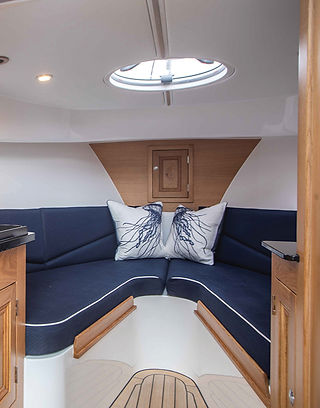 Cockwells, Cockwells Modern and Classic Boatbuilding, Cockwells boatbuilding Cornwall, Mylor Creek Boatyard, Falmouth Cornwall, Duchy Motor Launches, Duchy 25, Duchy 25 motor launch, luxury motor launch, modern cruiser, classic boat design, bespoke boatbuilder, British boatbuilder, Cornwall boatbuilder, semi-production launch, luxury launch Cornwall, motor launch UK, heritage boat design, traditional craftsmanship, contemporary boatbuilding, coastal cruising boat, estuary cruising boat, river cruiser, open-air cockpit, custom boat interior, outboard motor launch, electric motor launch, petrol outboard boat, trailerable boat, 25ft motor launch, premium day boat, weekend cruiser, luxury boating lifestyle, Raymarine display, synthetic teak decks, bespoke marine design, handcrafted boat, Southampton International Boat Show, Pendennis Group, Hardy Marine, Cornish marine industry, British marine engineering