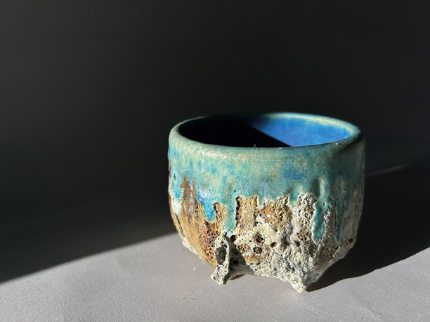 Installation views and artworks from What The Land Remembers at Cornwall Museum and Art Gallery, Truro, Cornwall, a major contemporary art exhibition celebrating women artists inspired by the Cornish landscape. Featured works include mixed media and oil paintings of Cornish seascapes, moorland and coastal light, alongside sculptural ceramics echoing weathered rocks and tidal textures. Artists include Ashleigh Anne, Amy Allbright, Charlotte Jones, Megan Gant, Natalie Day, Nina Brooke, Ruth Bateman, Sarah Woods, Sophie Carter and Tamsyn Trevorrow, with subjects spanning the Camel Estuary, Porthmeor, Hawkes Point and abstracted studies of land, sea and shifting light. The exhibition highlights contemporary Cornish art, landscape painting in Cornwall, coastal ceramics and creative practice rooted in Truro and across Cornwall, on show at Cornwall Museum and Art Gallery until August 2026.