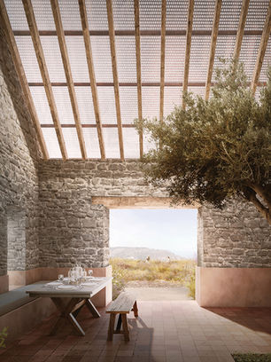 Rustic stone dining room with a set table, bench, and olive tree, opening to a sunny hillside view.