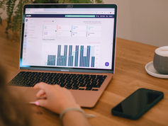 Laptop displaying a website analytics dashboard, illustrating the SEO performance data businesses can use to assess how their site is performing Website analytics shown on a laptop screen, supporting an article about checking and improving SEO for small business websites Person reviewing website performance metrics on a laptop, representing the kind of SEO audit and analysis needed to improve search visibility