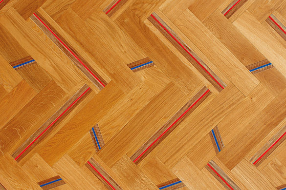 Herringbone flooring made of recycled materials by Stratum Marquetry