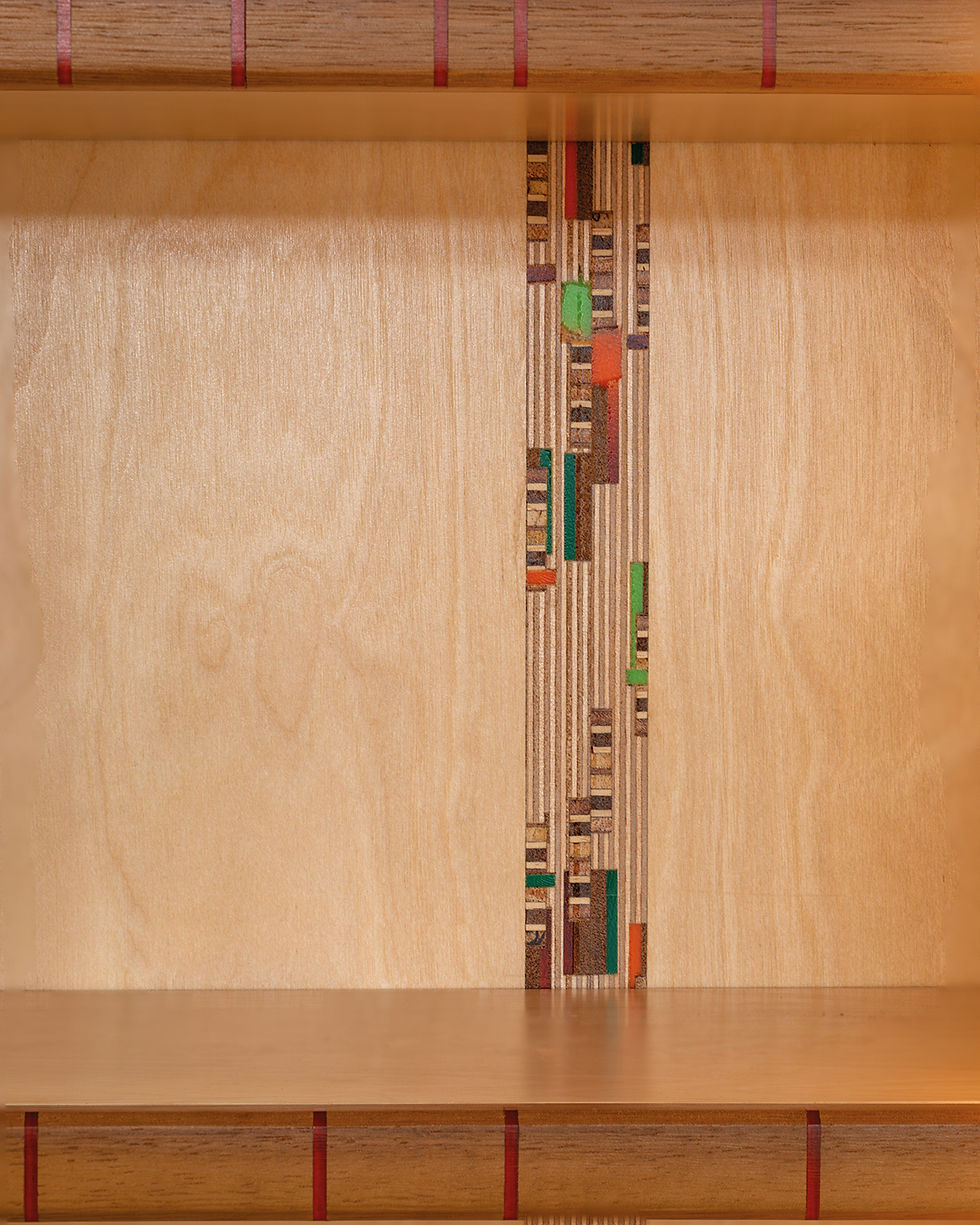 Detail within kitchen cabinetry and shelving lip