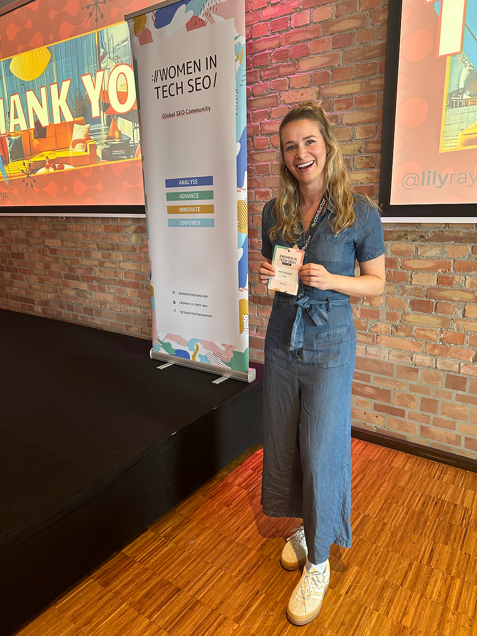 young woman laughing at a women in tech seo conference