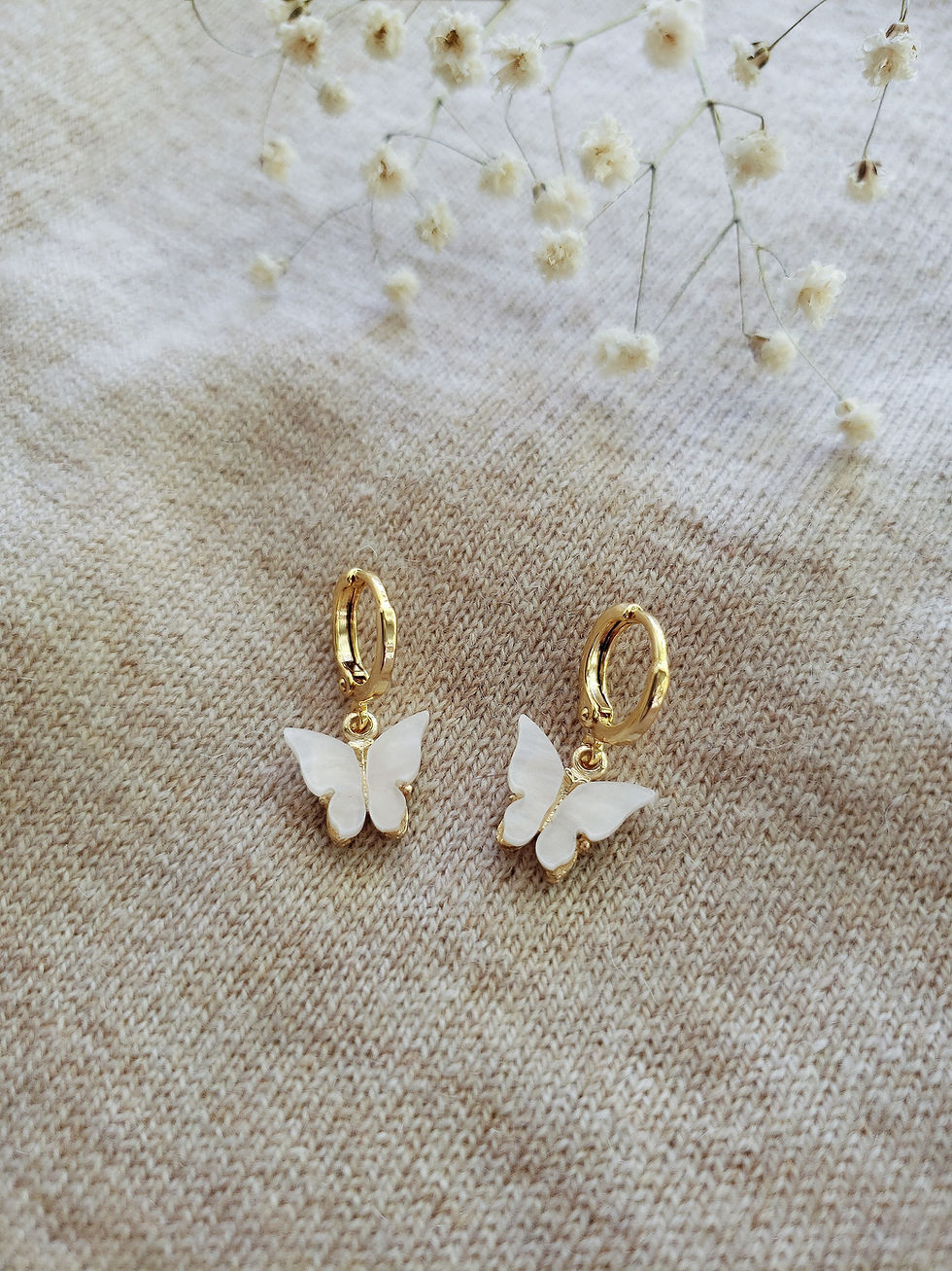 Thumbnail: White Pearlized Butterfly Huggies