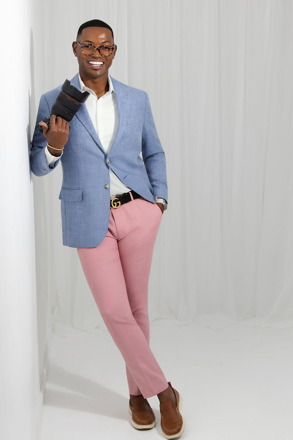 Man in a blue blazer and pink trousers at The Studio