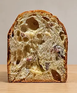 limited panettone by Fermento Bakery, sliced to show its naturally leavened crumb and inclusions
