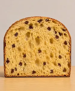Plant based chocolate panettone by Fermento Bakery with an airy crumb and dark chocolate pieces