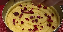 Frangipane cake being prepared by hand at Fermento Bakery