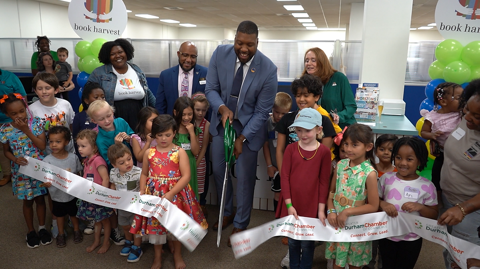 Book Harvest ribbon is cut, reopening the new space