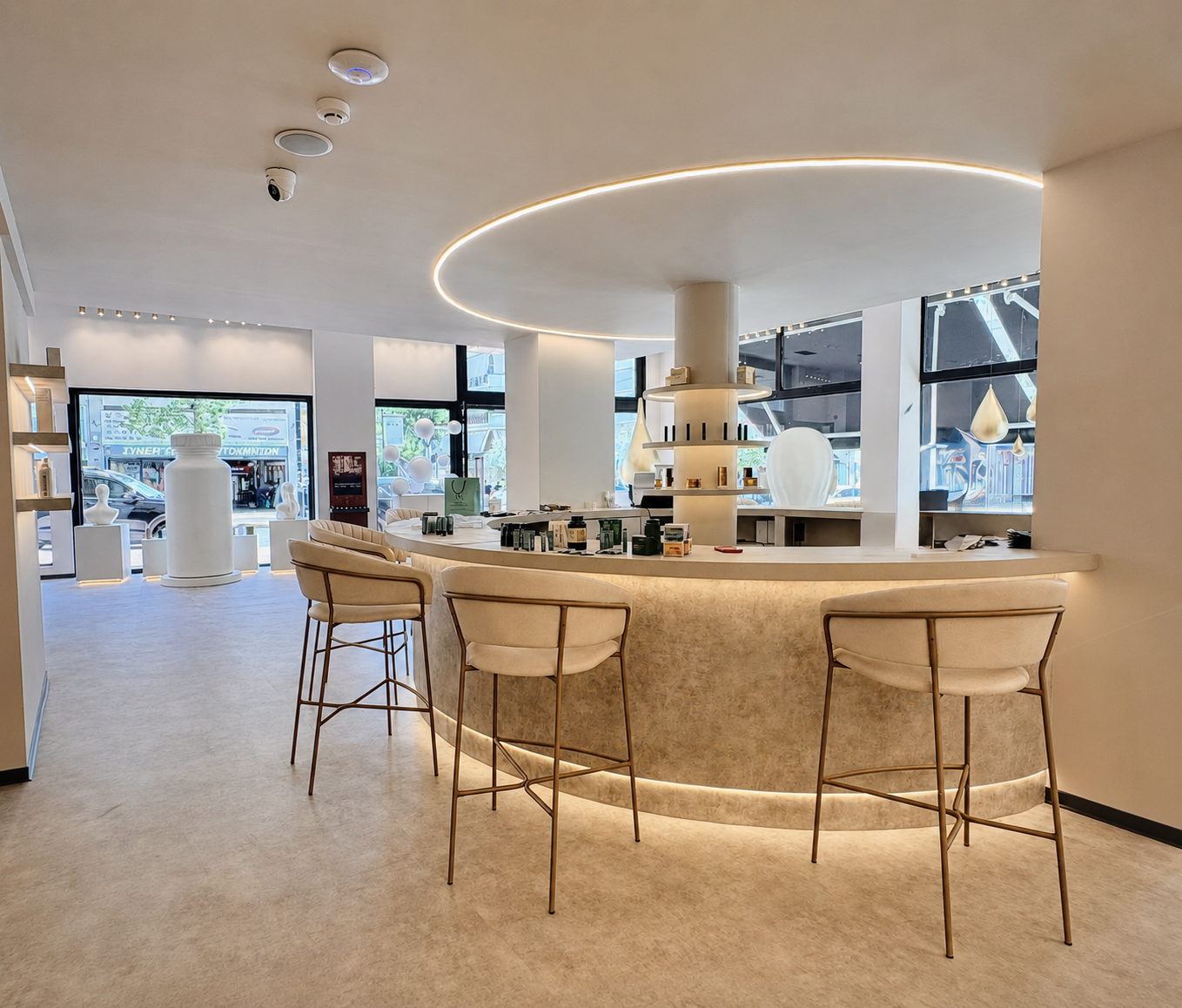 Street-facing view across the circular central bar at Vast Luxury, a High Frequency Spaces™ retail project by V-Architects.