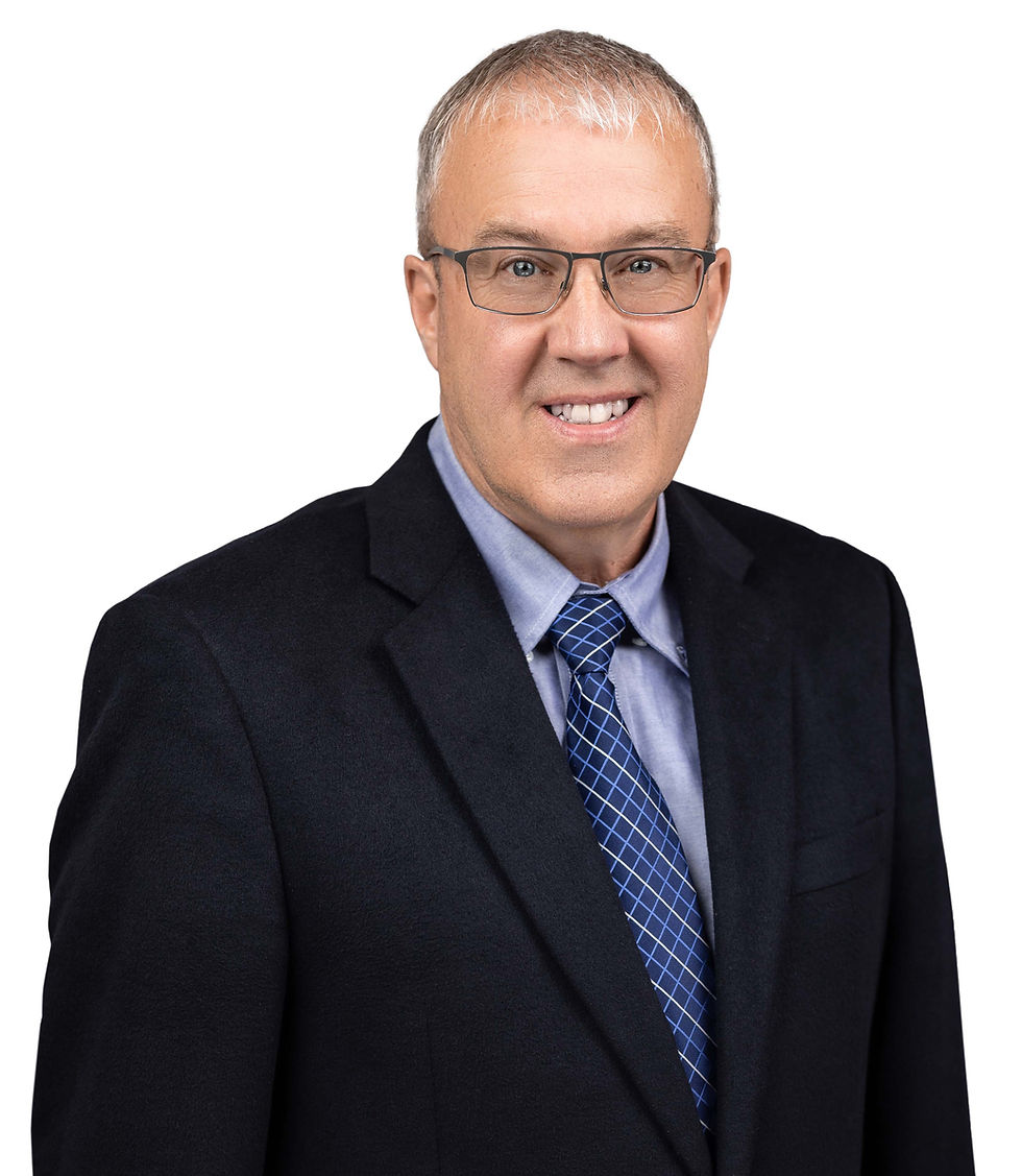 Professional real estate agent headshot on white background, landscape crop focusing on upper body, dark suit, blue tie, friendly expression.