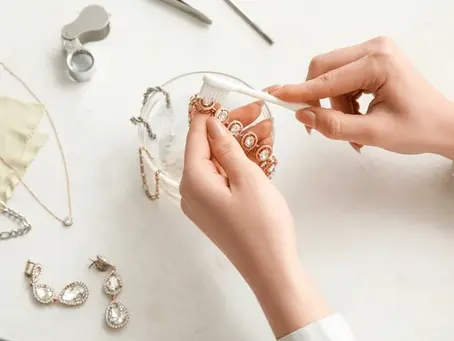 Jewelry care by cleaning with a brush using warm water and little soap