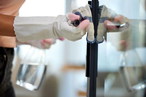 person-cleaning-glass-with-gloves-and-cloth-2026-01-09-10-35-02-utc.jpg