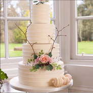 Buttercream effect fondant with sugar flowers and twigs