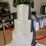 Lustred fondant with stencil details and hand painted fondant tartan swag