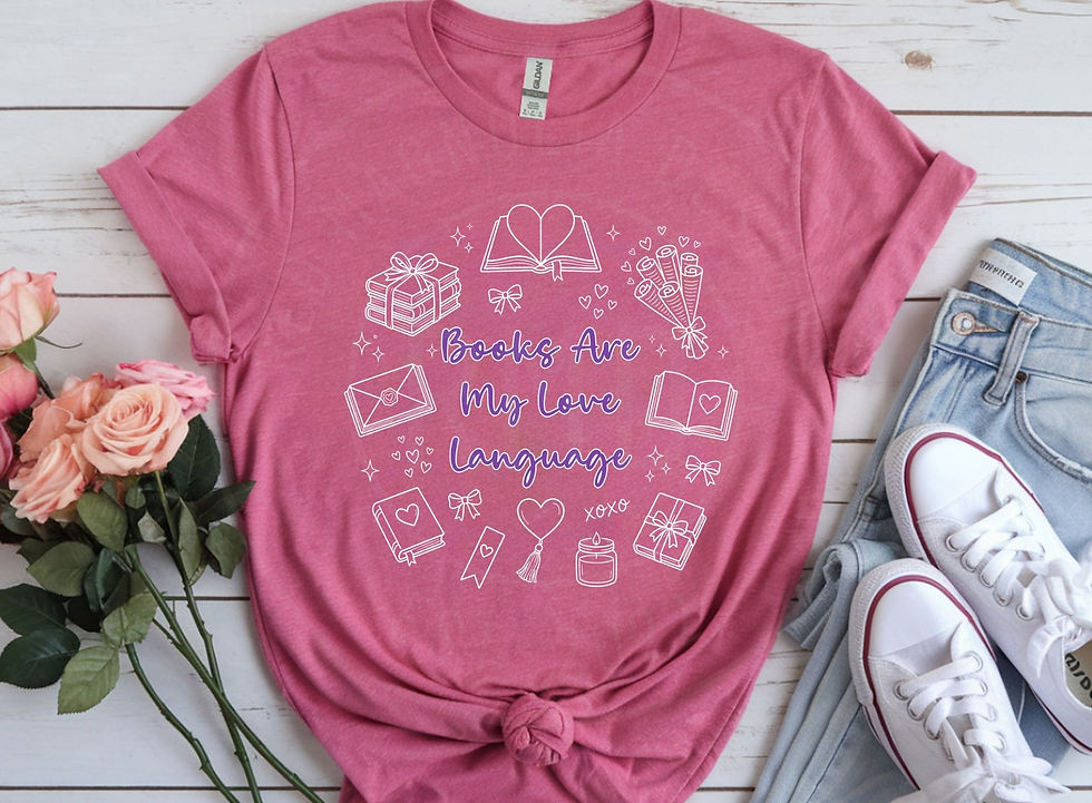 Pink book lover Valentine’s Day shirt with “Books Are My Love Language” text and book-themed icons styled with jeans and snea