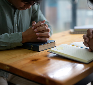 cropped-shot-of-worshiping-god-with-the-bible-2021-04-06-05-00-32-utc.jpg