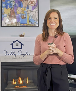 realtor standing by fireplace in living room