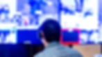 A man sitting at a video switcher directing a live stream