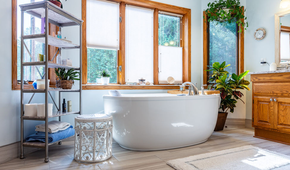 bright bathroom with white freestanding bathtub