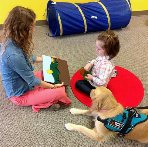 Drake with a child during therapy
