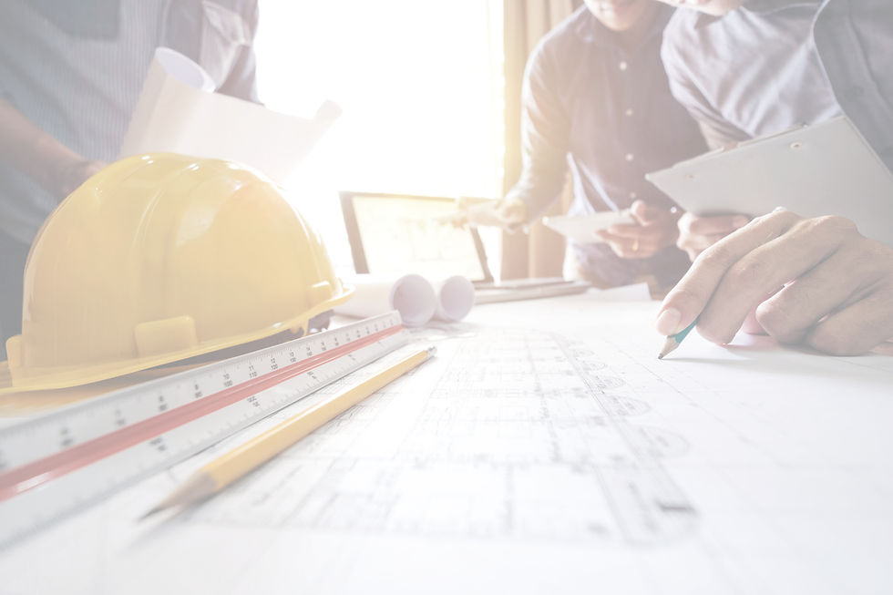 Construction drawings with hardhat and ruler