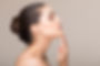 Side view of elegant woman with raised h