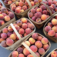 Baskets of peaches from Kalawi Farm in Eagle Springs, NC