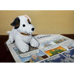 Oil painting of a stuffed animal dog sitting on the Sunday comics.