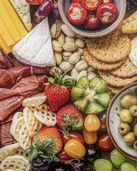 charcuterie-board-with-cold-cuts-fresh-fruits-cheese.jpg