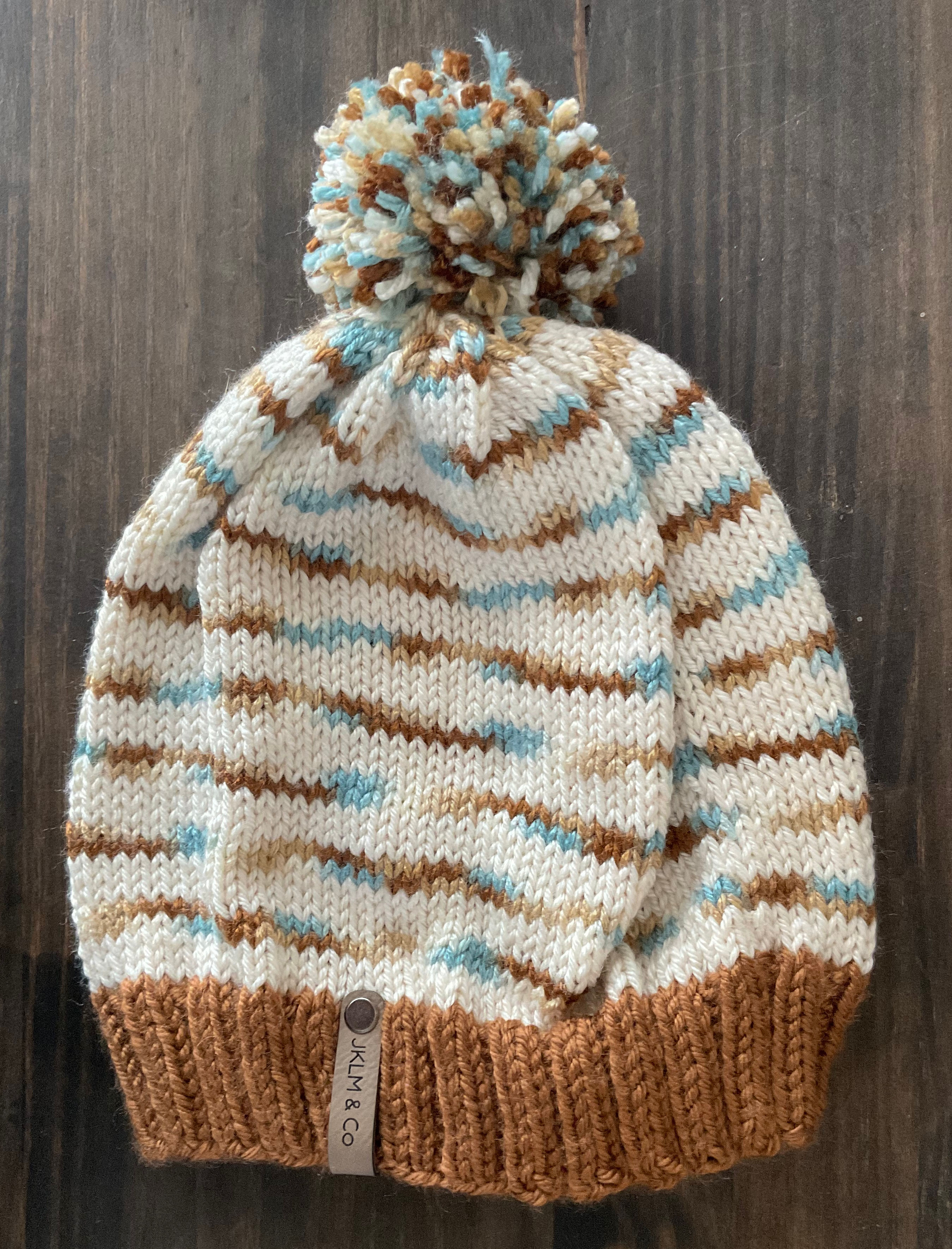 Ice and land pom hat