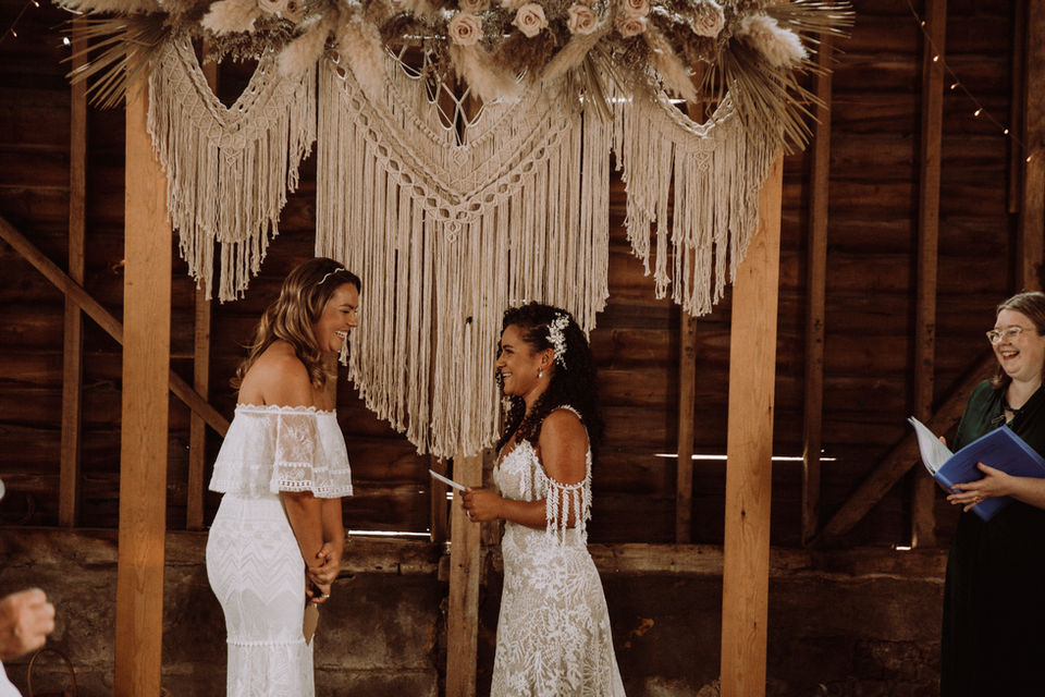 Same sex wedding with two brides getting married at The Barns at Lodge Farm in Essex by London wedding celebrant Mair Garland.