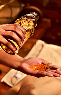 Young woman having oil massage spa treat