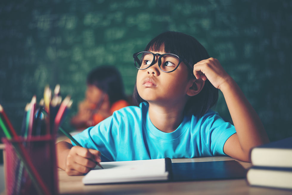 An asian student pondering
