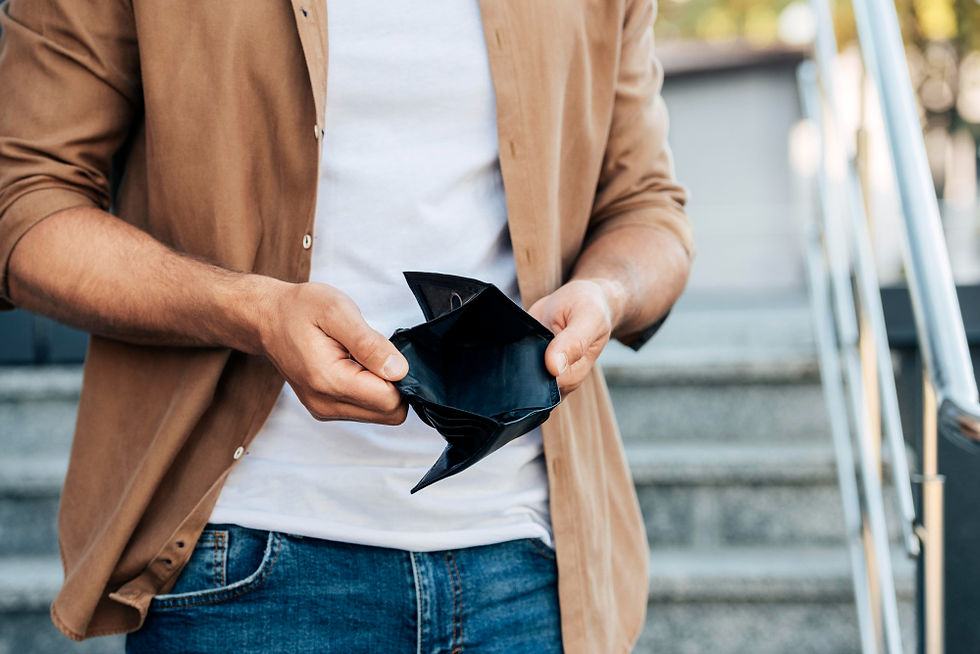 Man holding an empty wallet