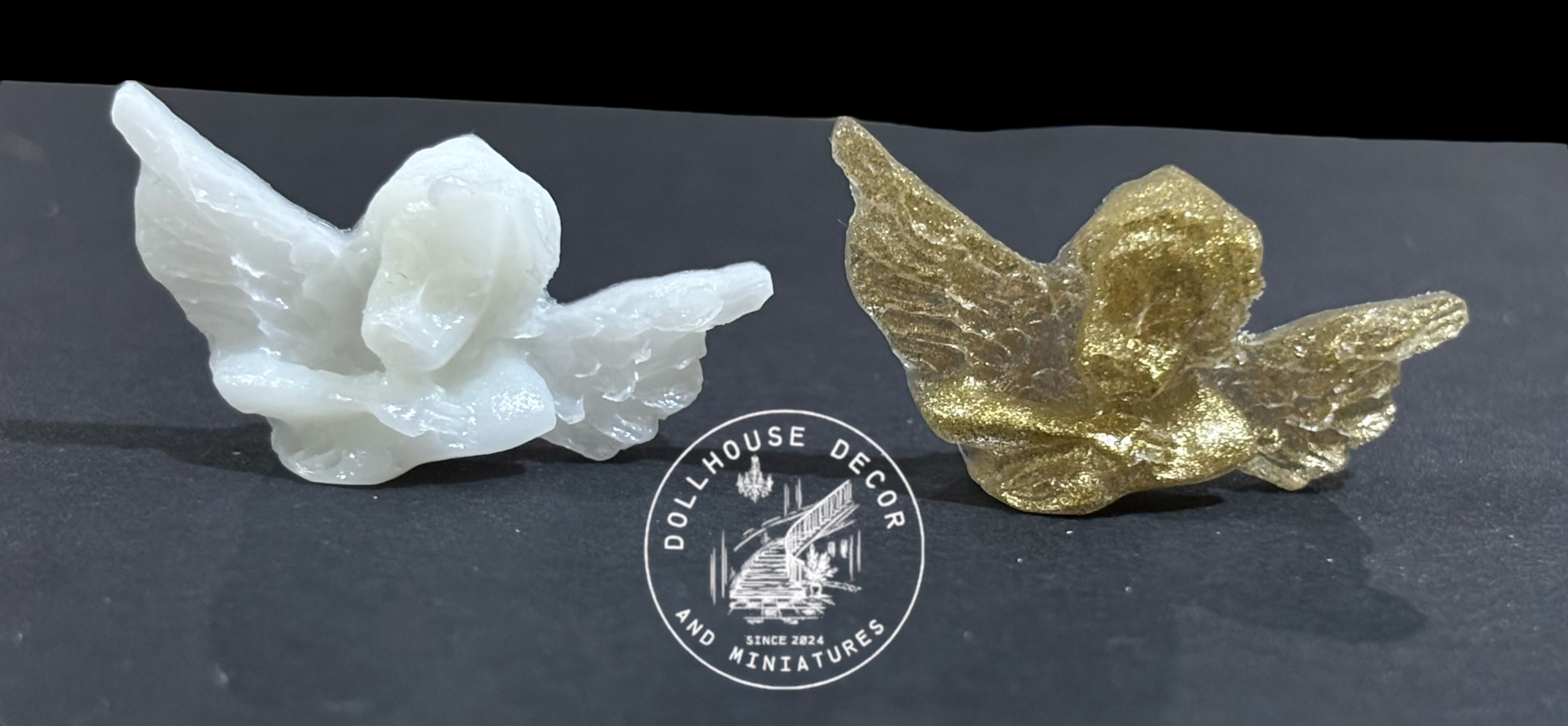 white and gold resin cast little cherub ornaments for a dollhouse