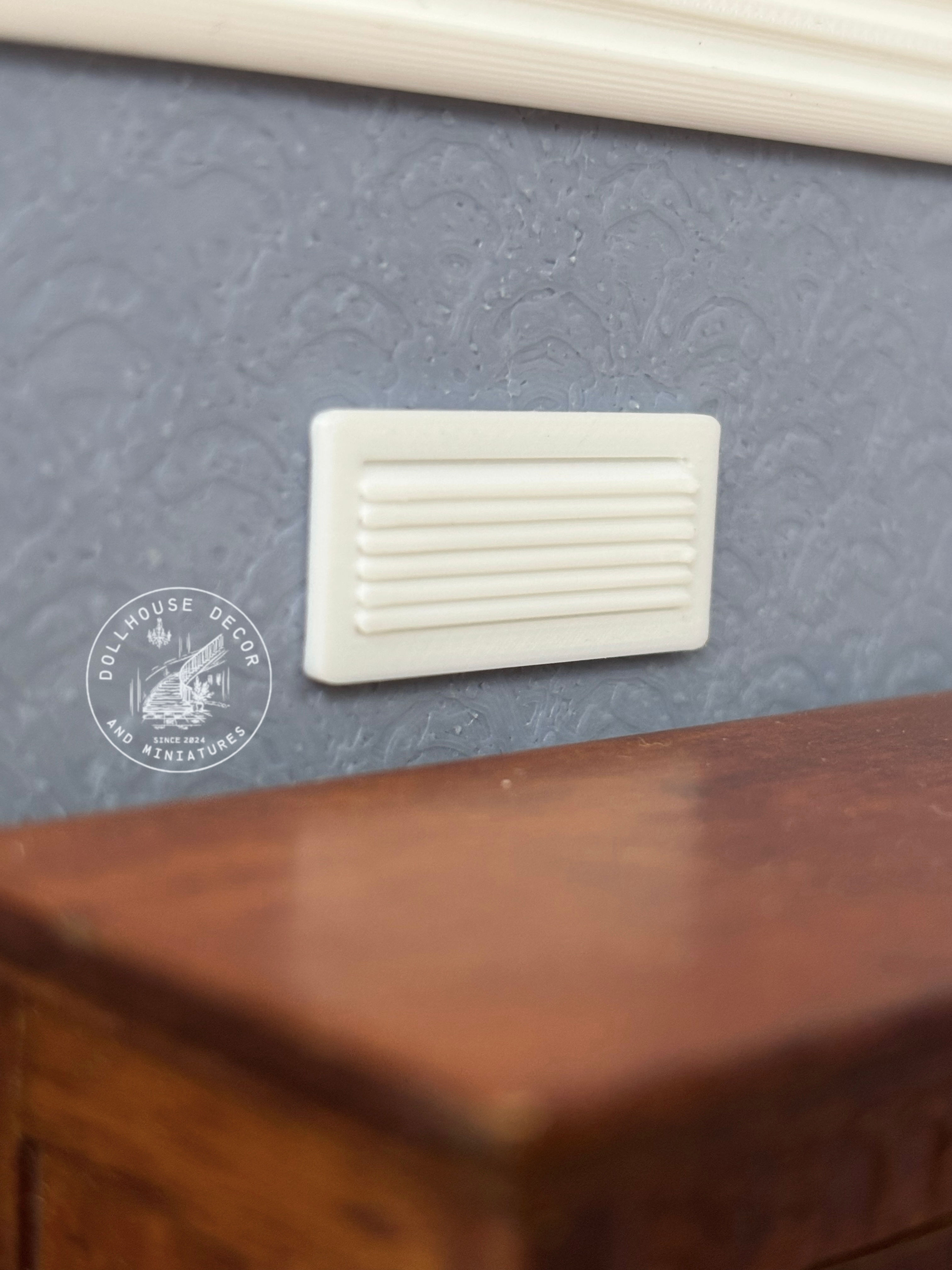 1:12 scale miniature wall air vent in white for dollhouse interiors.