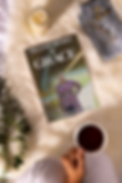 book-mockup-featuring-an-aesthetic-setting-with-coffee-and-a-candle-m26946.png