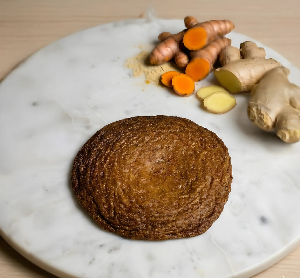 Dark brown cookie with ginger and turmeric roots