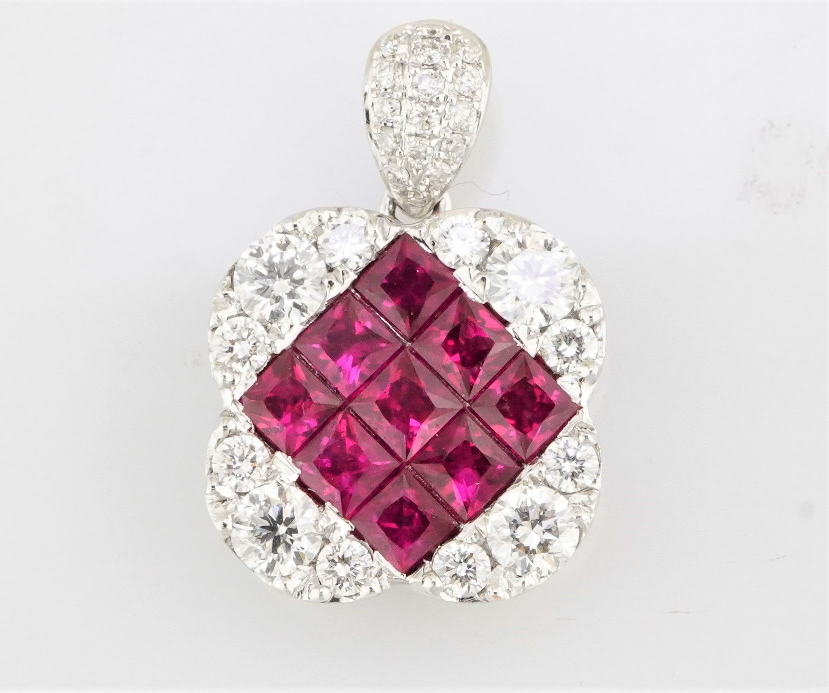 18k invisible set ruby and diamond pendant