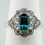 Thumbnail: Platinum Gilson emerald and diamond halo style ring