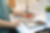 woman choosing kitchen countertop material texture from samples.jpg
