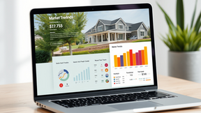 Laptop on wooden desk displaying real estate market trends, charts, and house image. Bright setting with a plant in the background.