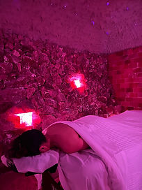 female in salt cave receiving therapy